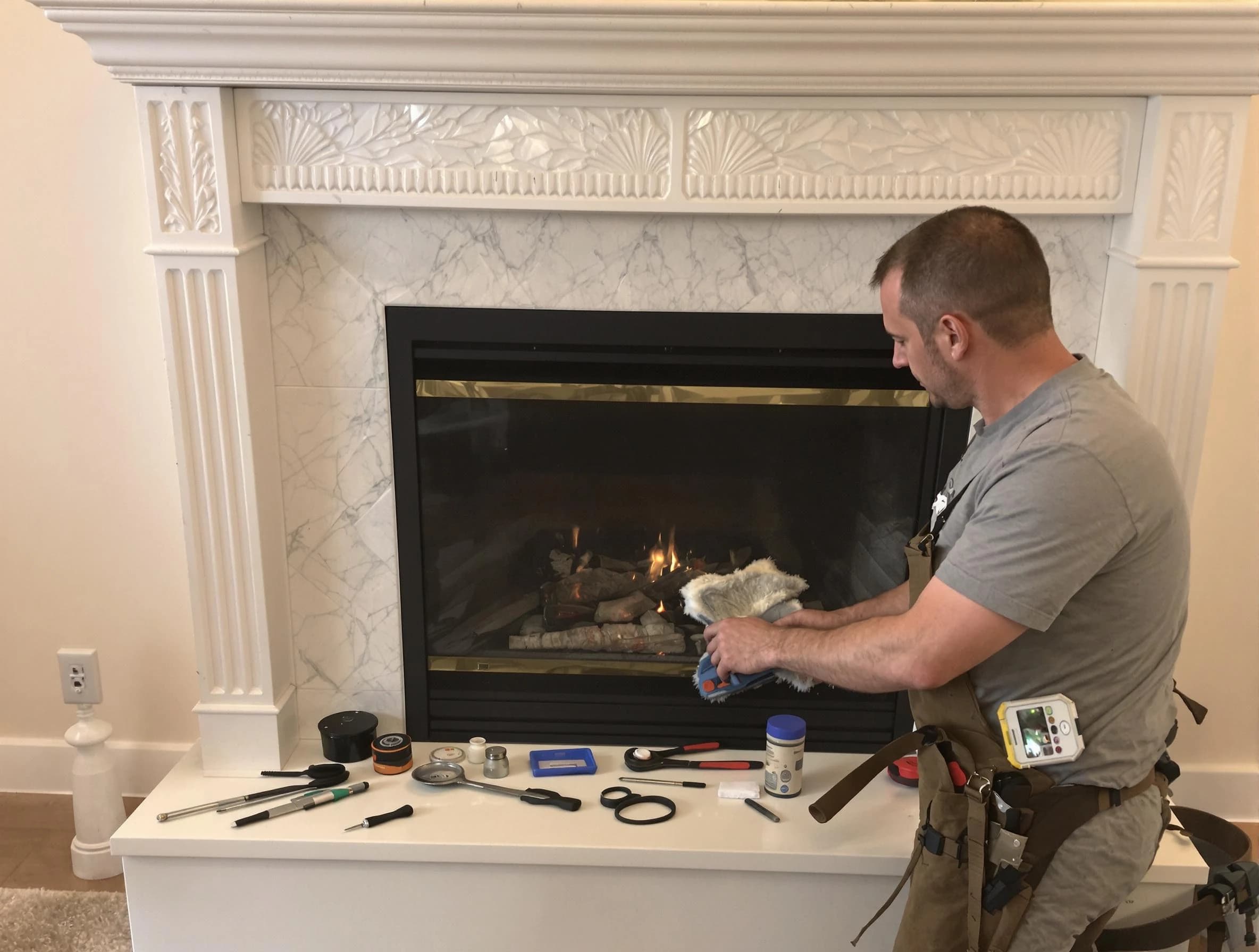 Old Bridge Chimney Sweep performing fireplace maintenance in Old Bridge, NJ